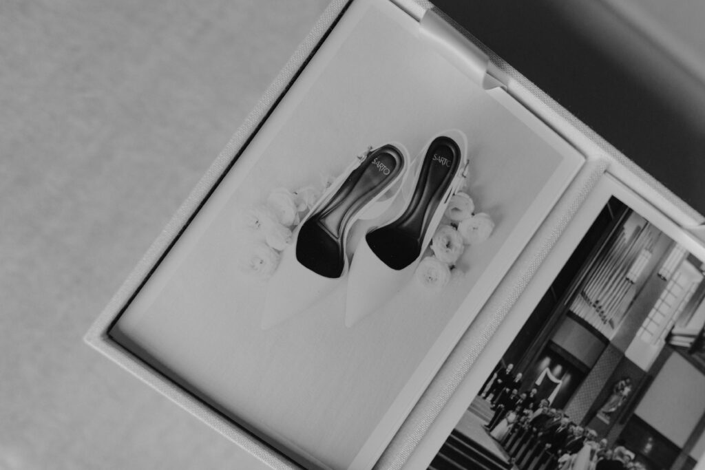 black and white photo of luxury wedding photo delivery experience