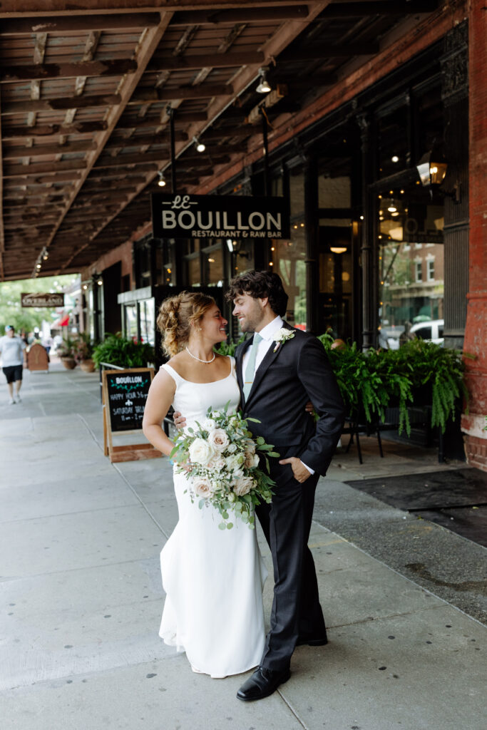 Bride and groom outside their intimate reception venue 