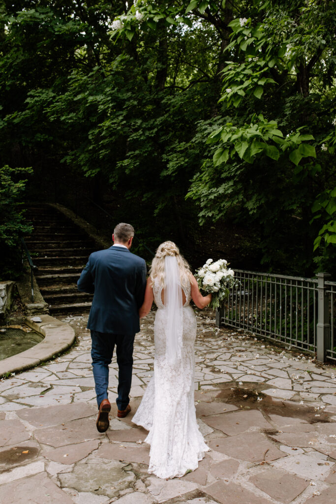 Bride and groom walk down the aisle after their intimate ceremony at the Elmwood Park Grotto in Omaha