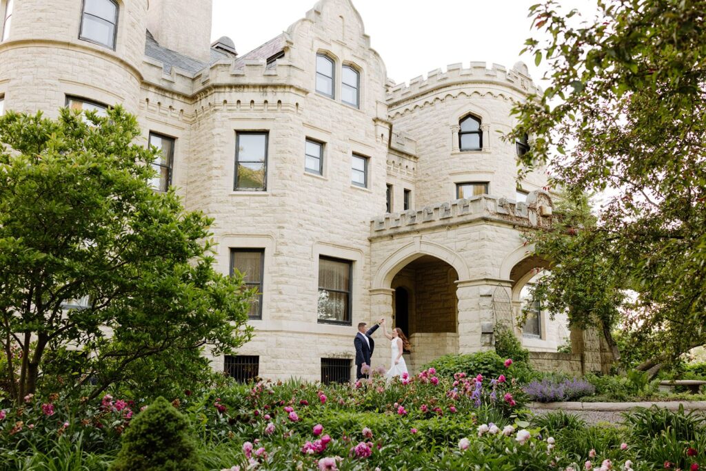 Bride and groom in front of Joslyn Castle in Omaha NE