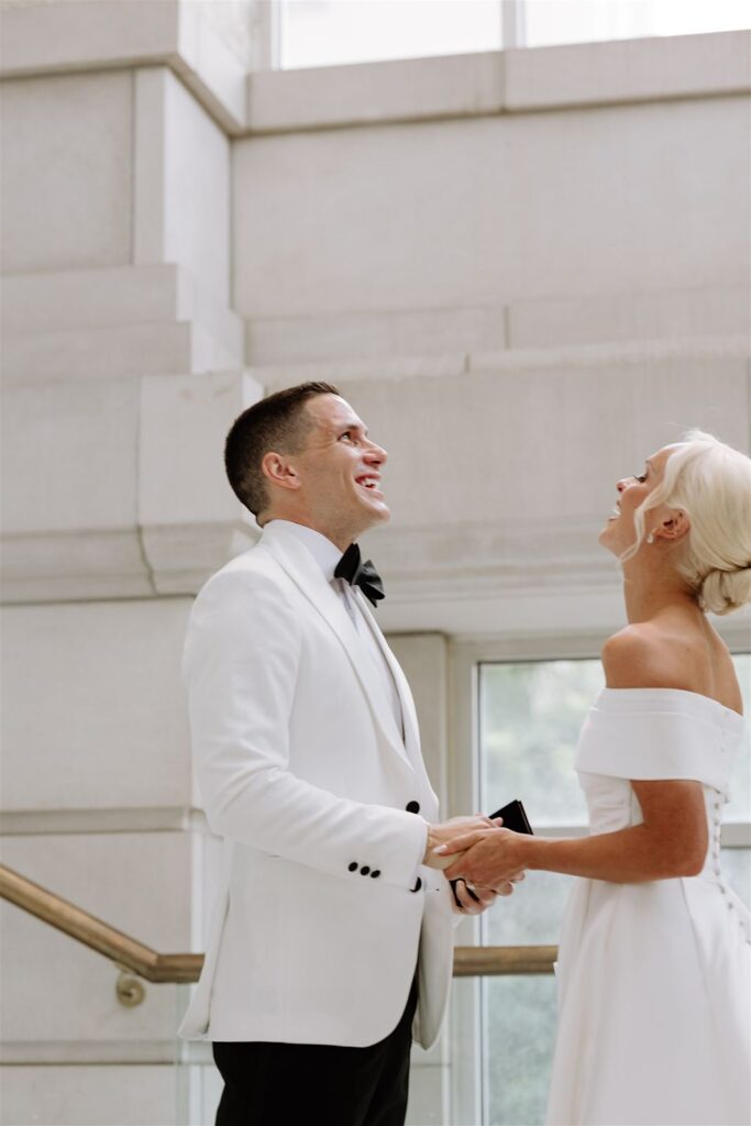 Bride and groom exchange vows at Leo Ballroom.