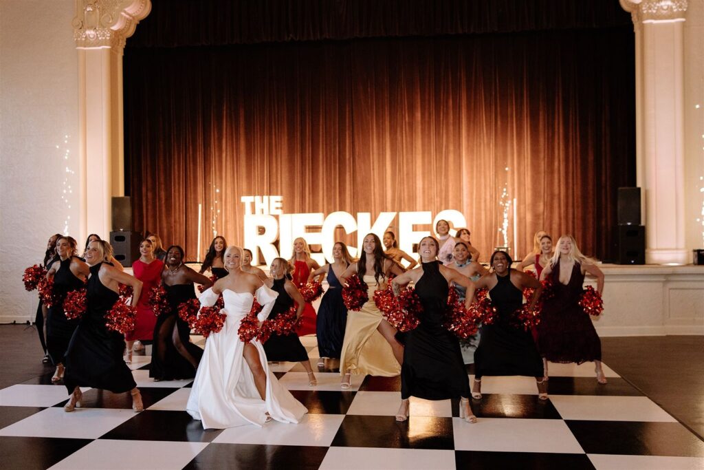 Cheerleaders dance at Leo Ballroom wedding reception.