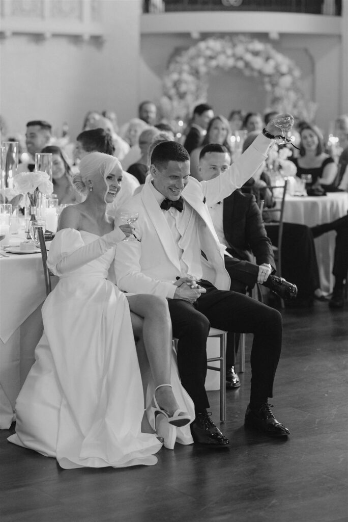 Bride and groom toast at Leo Ballroom wedding in Omaha.